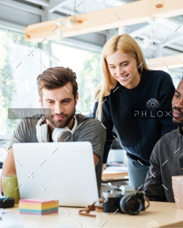 demo-attachment-447-happy-colleagues-sitting-in-office-coworking-PHYA6TG